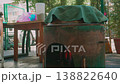 Close-up of cauldron with plov covered by cloth over wood fire 138822640