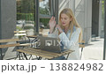 Professional Woman Having Online Meeting And Explaining Ideas At Street Cafe 138824982