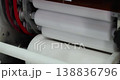 Close up of rotating rollers inside industrial machine processing material in factory. Automated stage of food production with mechanical system and modern equipment. 138836796