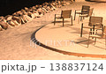 Public park infrastructure in snowy city showing benches and seating areas blanketed with fresh snow. Winter scene highlights urban outdoor culture and seasonal maintenance of recreational spaces 138837124