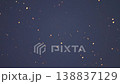Large snowflakes falling against dark blue night sky 138837129