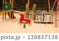Snow covered playground with old swings in European city 138837138