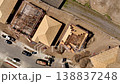 Aerial Vertical Descent Shot of a Busy Residential Housing Construction Site with Building Development Activity. 138837248