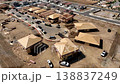 Aerial Orbit of a Busy Residential Housing Construction Site with Building Development Activity. 138837249