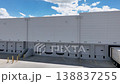Drone Orbit Shot Right to Left of Commercial Warehouse Loading Dock with Shipping Container 138837255
