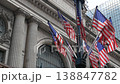 American flags near Grand Central Terminal on 42 street, New York USA. Railway building architecture 138847782