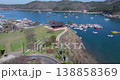 High-res aerial view of Ocheon Port in Boryeong, South Korea, showing boats, sea, and mountains 138858369