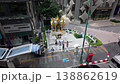 Elevated clip of Thais worshiping at the Thao Amarintharathirat with a Louis Vuitton store in the background. Bangkok, Thailand 138862619