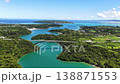Aerial footage of the Warumi Bridge leading to Kouri Island in Okinawa, with the sea ablaze in emerald green. 138871553