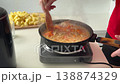 Person Prepares Delicious Homemade Stew With Vegetables. Homemade Meal Being Cooked By Chef In Kitchen 138874329