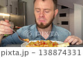 Home Cook Evaluating Potato Dish. Person Testing Seasoning And Texture Of Handheld Potato Stew 138874331