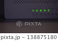 WiFi Router with Green LED Indicators Showing Active Connection 138875180