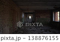 Desolate Old Passageway. Cracked Concrete Hallway Found. Abandoned Brick Pathway With Debris Scattered. Silent Corridor With Deteriorated Walls And Distant Entrance Illuminated By Sunlight 138876155