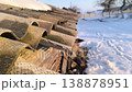 Snow melts on the roof, drops of water fall to the ground. Spring thaw. Spring mood. 138878951