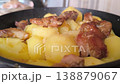 aromatic stewed potatoes in a deep plate.  138879067