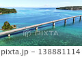 Okinawa Kouri Bridge and Kouri Island: Aerial footage of the emerald green sea and the bridge. 138881114