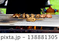 Delicious rhythm: Craftsman's hand-held meat skewered over charcoal, quickly roasted, inviting people to take in the aroma 138881305