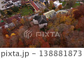 Aerial shot of Schloss Stein an der Traun, Bavaria, Germany. Medieval rock castle and cave fortress surrounded by colorful autumn forest. Historic fortress on Nagelfluhwand above Traun valley.  138881873