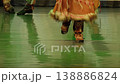 Unrecognizable injuns northern Indians dance a national and ritually jump in traditional clothing on stage with ancient instruments. Culture of the Peoples of the World 138886824