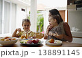 Close up of happy family having breakfast together 138891145
