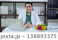 Asian nutritionist using laptop in clinic office, online consultation, healthcare advice. 138893375