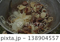 Frying meat with onions in a cauldron. Cooking pilaf. National cuisine 138904557