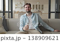 Relaxed Man Sitting On Sofa And Switching TV Channels With Remote Control 138909621