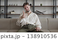 Cheerful Man Showing Thumbs Up During Video Call At Home Office 138910536