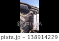 Snow melts on the roof, drops of water fall to the ground. Spring thaw. Spring mood. 138914229