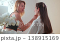 Beautician applying makeup on woman face with 138915169