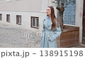Young woman checking time and waving while waiting 138915198