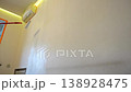 Person painting wall with white roller 138928475