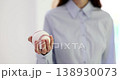 Hand of a businesswoman holding baseball on white background 138930073