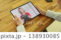 Witness to crime flips through photo on tablet of suspects in crimes 138930085