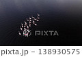 Flock of flamingos feeding in a dark water wetland lake, aerial drone view 138930575