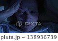 Elderly woman suffering from migraine lying in bed at night 138936739