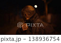 Frightened man walking alone on dark city street  138936754