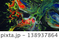 Moving marble texture background. Fluid art of flowing red, blue, green and yellow colors on a black background. 138937864