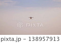 Professional agricultural multi-rotor drone flying in the sky 138957913