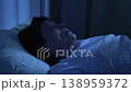 Woman sleeping and snoring with mouth open at night 138959372