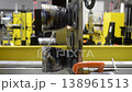 Wire-cut electrical discharge machine. Operation of wire-EDM machine cutting metal parts. Electrical discharge machine EDM cutting metal workpiece. Cutting process by wire cut machine. Vertical 138961513