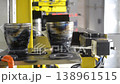 Wire-cut electrical discharge machine. Operation of wire-EDM machine cutting metal parts. Electrical discharge machine EDM cutting metal workpiece. Cutting process by wire cut machine. Vertical 138961515