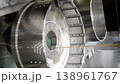 Wire-cut electrical discharge machine. Operation of wire-EDM machine cutting metal parts. Electrical discharge machine EDM cutting metal workpiece. Cutting process by wire cut machine. Vertical 138961767