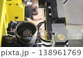 Wire-cut electrical discharge machine. Operation of wire-EDM machine cutting metal parts. Electrical discharge machine EDM cutting metal workpiece. Cutting process by wire cut machine. Vertical 138961769