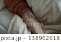 Hand with attached IV drip or cannula receiving fluids 138962618