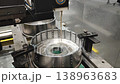 Wire-cut electrical discharge machine. Operation of wire-EDM machine cutting metal parts. Electrical discharge machine EDM cutting metal workpiece. Cutting process by wire cut machine. Metalworking 138963683