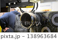 Wire-cut electrical discharge machine. Operation of wire-EDM machine cutting metal parts. Electrical discharge machine EDM cutting metal workpiece. Cutting process by wire cut machine. Metalworking 138963684