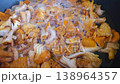 Fresh Chanterelle Mushrooms Cooking in Bubbling Pan for Autumn Recipes and Culinary Inspiration 138964357