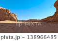 Aerial view of sand tracks and sandstone rock formations in the desert valley of Wadi Rum, Jordan. 138966485
