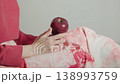 Red apple in female hand 138993759